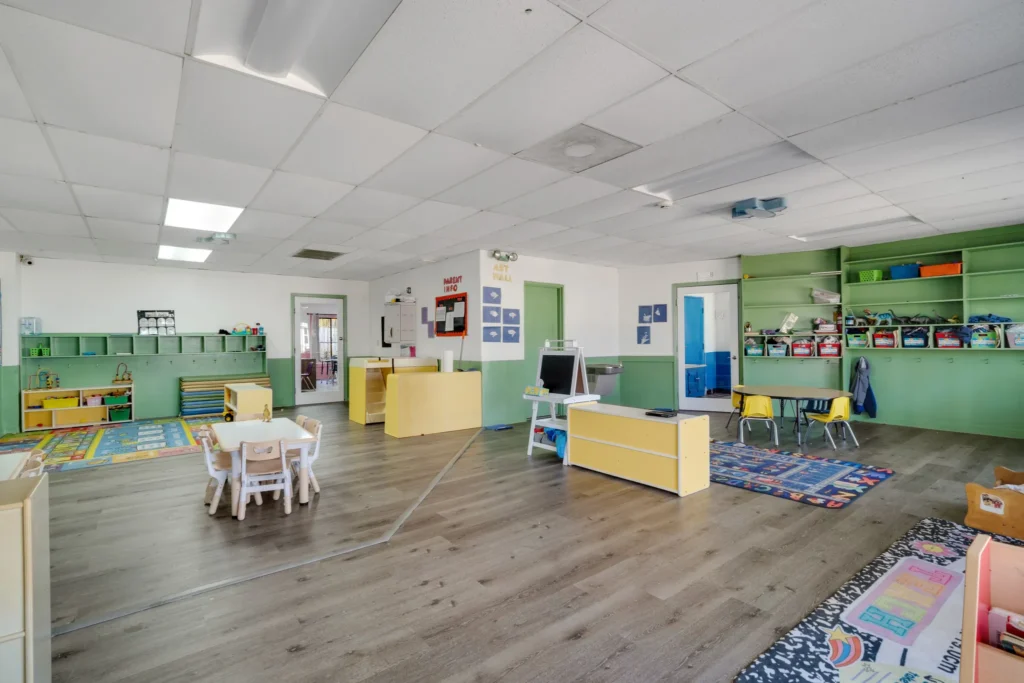 Bright and spacious classroom at Chroma Early Learning Academy, featuring colorful furniture, educational materials, and a nurturing environment for preschool children.